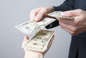 Man counting out money.