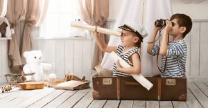 kids in a suit case exploring